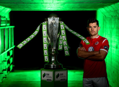 Ronan Murray pictured alongside the Premier Division trophy at the launch of the 2019 SSE Airtricity League season.