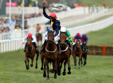City Island ridden by jockey Mark Walsh wins the Ballymore Novices' Hurdle during Ladies Day.