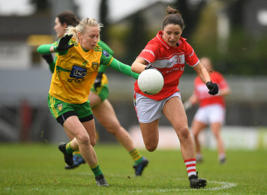 Eimear Scally of Cork in action against Treasa Doherty of Donegal.