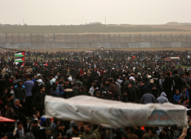 Palestinian protesters clash with Israeli troops on the Gaza-Israel border.
