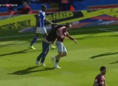A fan punches Jack Grealish in the head from behind, flooring the Villa star.