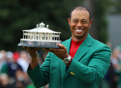 Woods claimed a fifth Green Jacket yesterday.