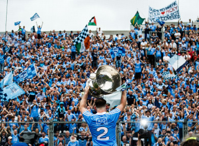 Dublin's Philly McMahon parades Sam Maguire in front of Hill 16 last September.