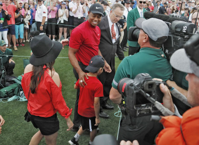 Woods celebrates with his children at Augusta.