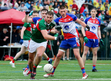 Aidan O'Shea and Matthew Queenan battle for possession.