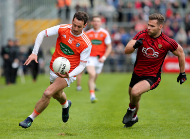 Gerard Collins chases after Jamie Clarke.