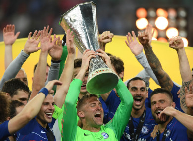 Green lifts the Europa League trophy surrounded by his Chelsea team-mates.