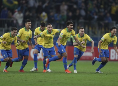 Brazil celebrate winning at the end of the shootout.