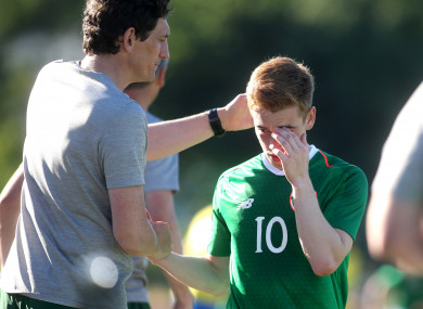Ireland coach Keith Andrews consoles Connor Ronan after the game.