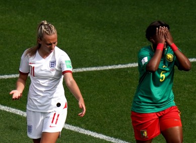 England's Toni Duggan (left) reacts after she is spat on by by Cameroon's Augustine Ejangue (right).