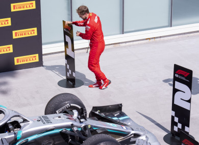 Vettel moving the number one sign to where his car should have been.