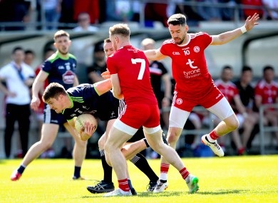 Kildare's Kevin Feely in action against the Tyrone defence.