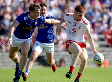 Cathal McShane in action for Tyrone against Cavan's Padraig Faulkner.