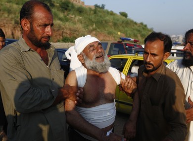 People help an injured victim following the crash.