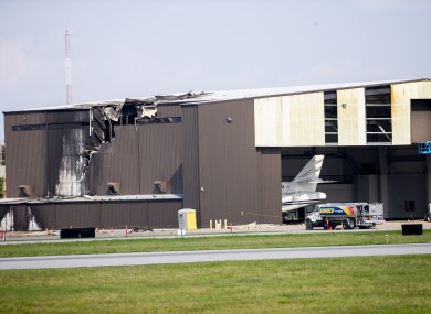 Damage is seen to a hangar after a twin-engine plane crashed into the building at Addison Airport in Addison, Texas,