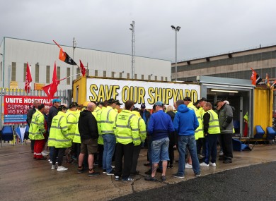 Harland and Wolff workers listen to union officials from Unite and GMB today