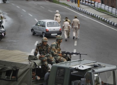 Indian army soldiers guard during restrictions in Jammu, India,