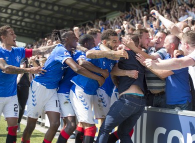 Rangers players and fans celebrate together after Borna Barisic's winner.