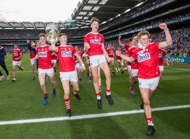 Cork players celebrate after the game.