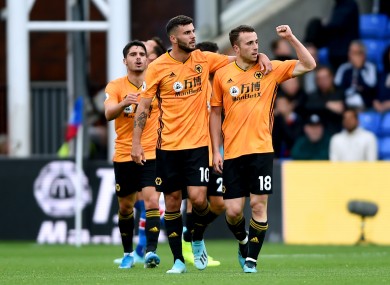 Diogo Jota is congratulated by team-mates after scoring for Wolves against Crystal Palace.