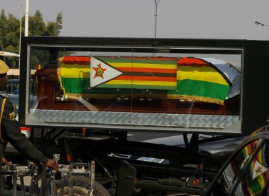 The body of former Zimbabwe’s president Robert Mugabe leaves the National Sports Stadium where the international delegates, friends of Mugabe and other dignitaries paid last respect