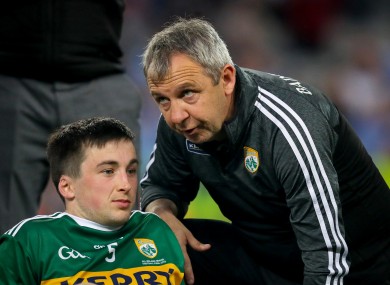 Kerry's Paul Murphy with manager Peter Keane after the game.