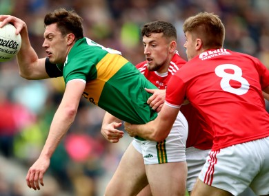 David Moran tackled by Nathan Walsh and Ian Maguire in this year's Munster decider.