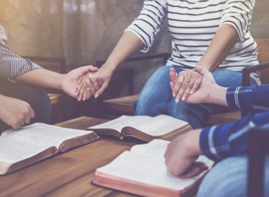 A group engaged in prayer.