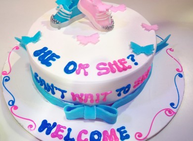 People gather at a gender reveal party to find out the gender of an unborn baby.