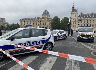 Police at the scene of yesterday's stabbing in Paris.