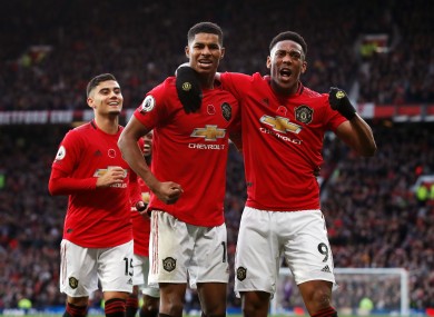 Marcus Rashford celebrates his third goal with Anthony Martial.