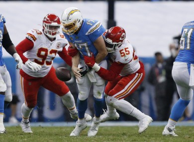 Chargers quarterback Philip Rivers, center, is sacked by Kansas City Chiefs defensive end Frank Clark and defensive tackle Joey Ivie.