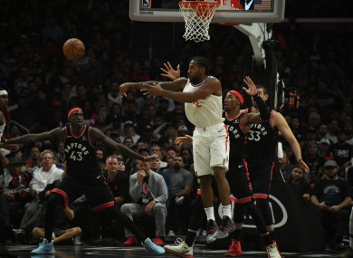 LA Clippers forward Kawhi Leonard passes the ball.