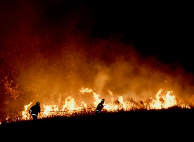 Firefighters tackle bushfires in Australia.