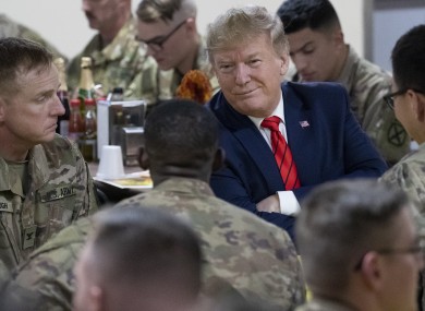 Trump speaking with US soldiers during his visit.