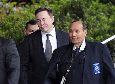 Tesla CEO Elon Musk, second from right, arrives at the US District Court.