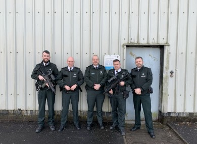PSNI chief constable Simon Byrne, centre, alongside officers in Crossmaglen.
