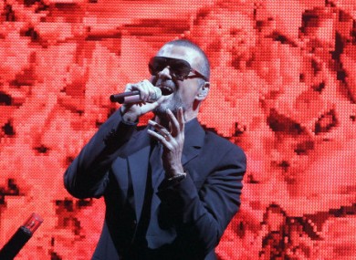 George Michael performs on stage in Paris in 2011.