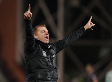 Lennon celebrates at full-time after their 2-0 win over Hearts.