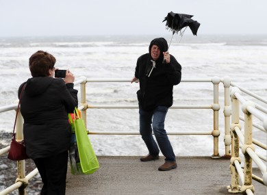 Tourists taking a photo during previous weather warnings in October.
