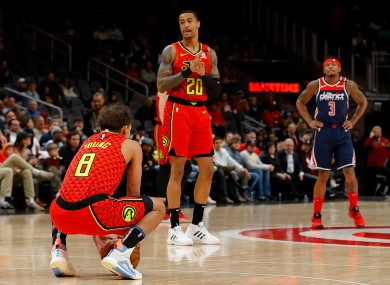 Atlanta Hawks guard Trae Young holds the ball