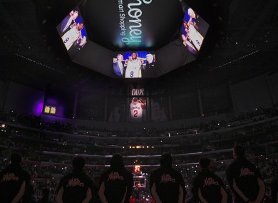 The Los Angeles Clippers stand for a video tribute to Kobe Bryant.