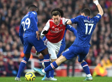 Mesut Ozil takes on Chelsea