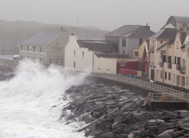 Waves crash agains the sea wall in Lahinch, County Clare.