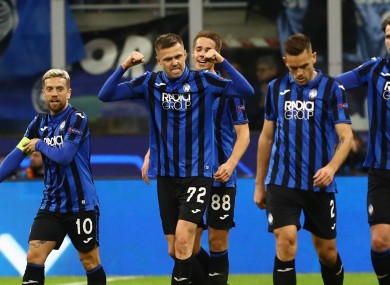 Atalanta players celebrate their second goal against Valenica