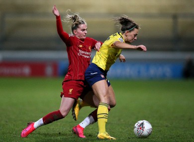 Liverpool's Melissa Lawley (left) and Arsenal's Katie McCabe (right) battle for the ball.