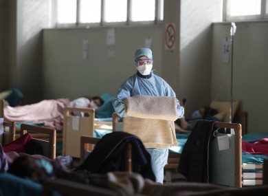 Medical staff work at one of the emergency structures that were set up to ease procedures at the Brescia hospital, northern Italy.