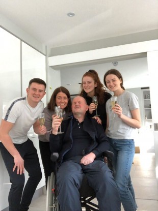 Sean at home with his family.