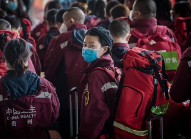 Medical worker Cheng Xiaoxue waits to board a train at the Wuhan Railway Station.