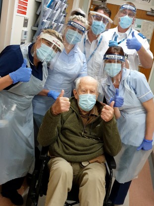 Keith Watson and some of the medical staff who looked after him in hospital.